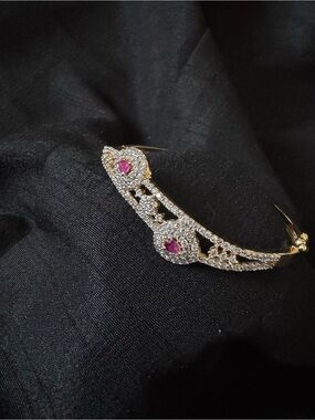 Gold Tone Bangle Bracelet with Pink Gem Accents